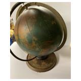 vintage terrestrial globe in pretty bad condition