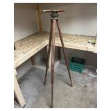 surveyor's transit on wooden tripod