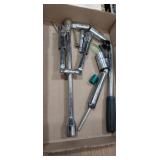 Spark plug sockets , folding 4 way tire iron,
