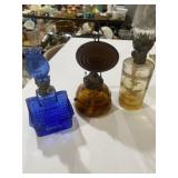 Three miniature oil lamps