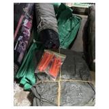 Large tarp tent with plastic tent stakes, hunting