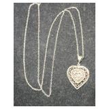 Silver heart necklace marked 925.     .160oz