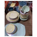 Large lot of pastel-colored melamine dishes.