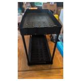 Plastic 2 tiered under sink rack. Bottom rack