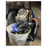 Tote with lawn and garden tools, wheels, sprayers