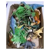 Lot of toy dinosaurs and other animals
