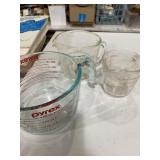 Two Pyrex measuring cups and one fire king
