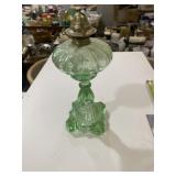 green glass oil lamp
