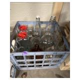 Crate of vintage glass bottles