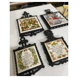 4 cast iron and ceramic trivets