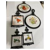 5 cast iron and ceramic trivets