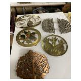 Collection of various decorative trivets