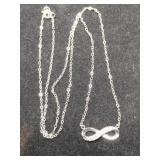 Silver criss cross pendant necklace marked 925.