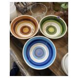 Colorful bowls marked Japan and glass mixing bowl