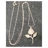 Silver rose pendant marked 925.  .140oz