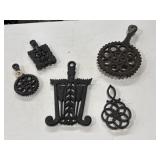 5 cast iron trivets