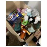 Box full of plush animals, toys, and more