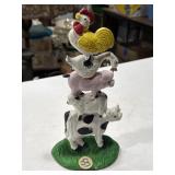 cast iron doorstop of a stacked totem of farm