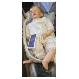 Doll cradle with hand crafted porcelain baby doll