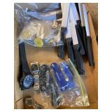 Flat of knives, watches, and buttons