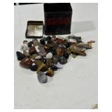 Polished rocks in old Atlas bank tin