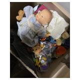 Box full of dolls, toys, and figurines