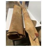 Two rolls of tanned leather