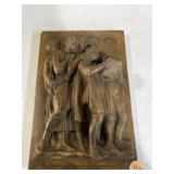 decorative plaque depicting a group of choir boys
