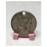 1964 Kennedy half dollar with hole