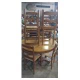 Round wooden dinning table with 8 matching chairs