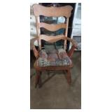 Wooden rocking chair with arms