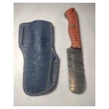 Orange handle rounded end Damascus steel knife w/