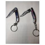 2 green and pink  handled pocket knife keychains