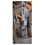 Assortment of hand saws and level