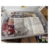 Tote of various needlework supplies and hobby