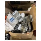 Box full of different brackets and other hardware
