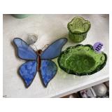 Green glass candle dishes and butterfly light