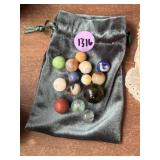 Old marbles with shooter and pouch