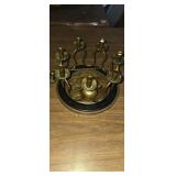 Round brass candelabra with candle snuffer and