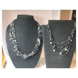 2 black /white beaded necklaces both have five