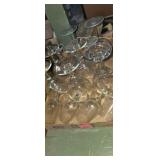 Assortment of various size clear wine glasses