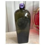 dark olive green molded glass case bottle Marked