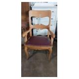 Wooden armed chiar with leather upholstered