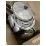 Collection of cookware, including pots, pans, and