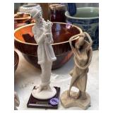 Lady with dog figurine and abstract embracing