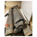 Three rolls of tanned leather