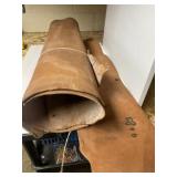 One roll of tanned leather and one strip of