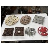 Wooden, metal ornately designed trivets