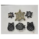 Turtle, owl, and fish brass and cast iron trivets