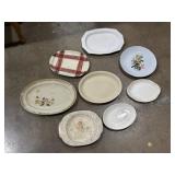 Various size serving platters and plates, some